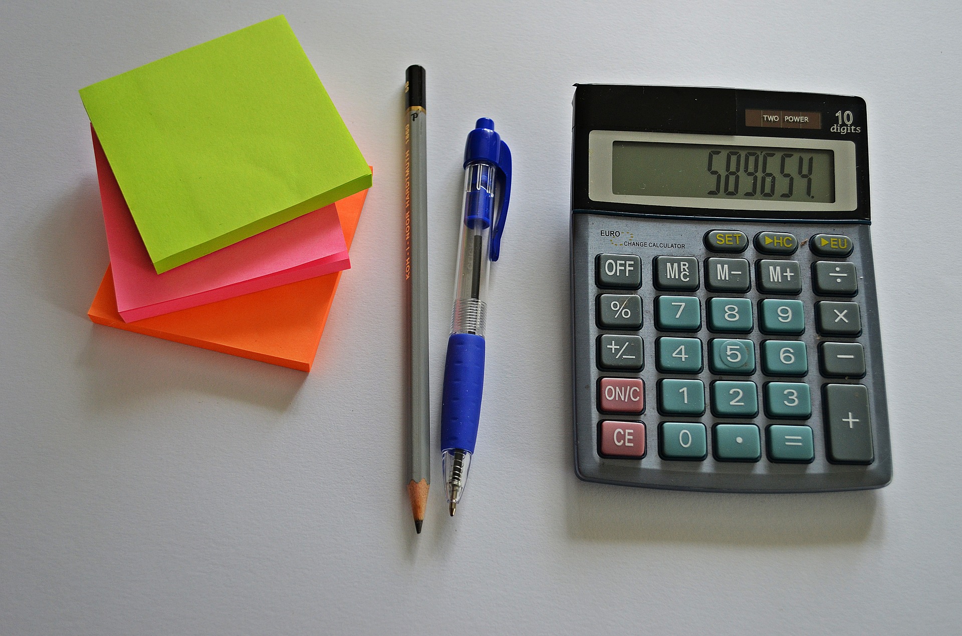 calculator, pen, pencil, post-its